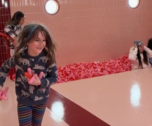 Girl running next to a pit of large sprinkles. Jordana Drell